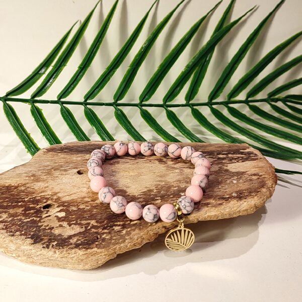 Pink stone bracelet with palm leaf pendant